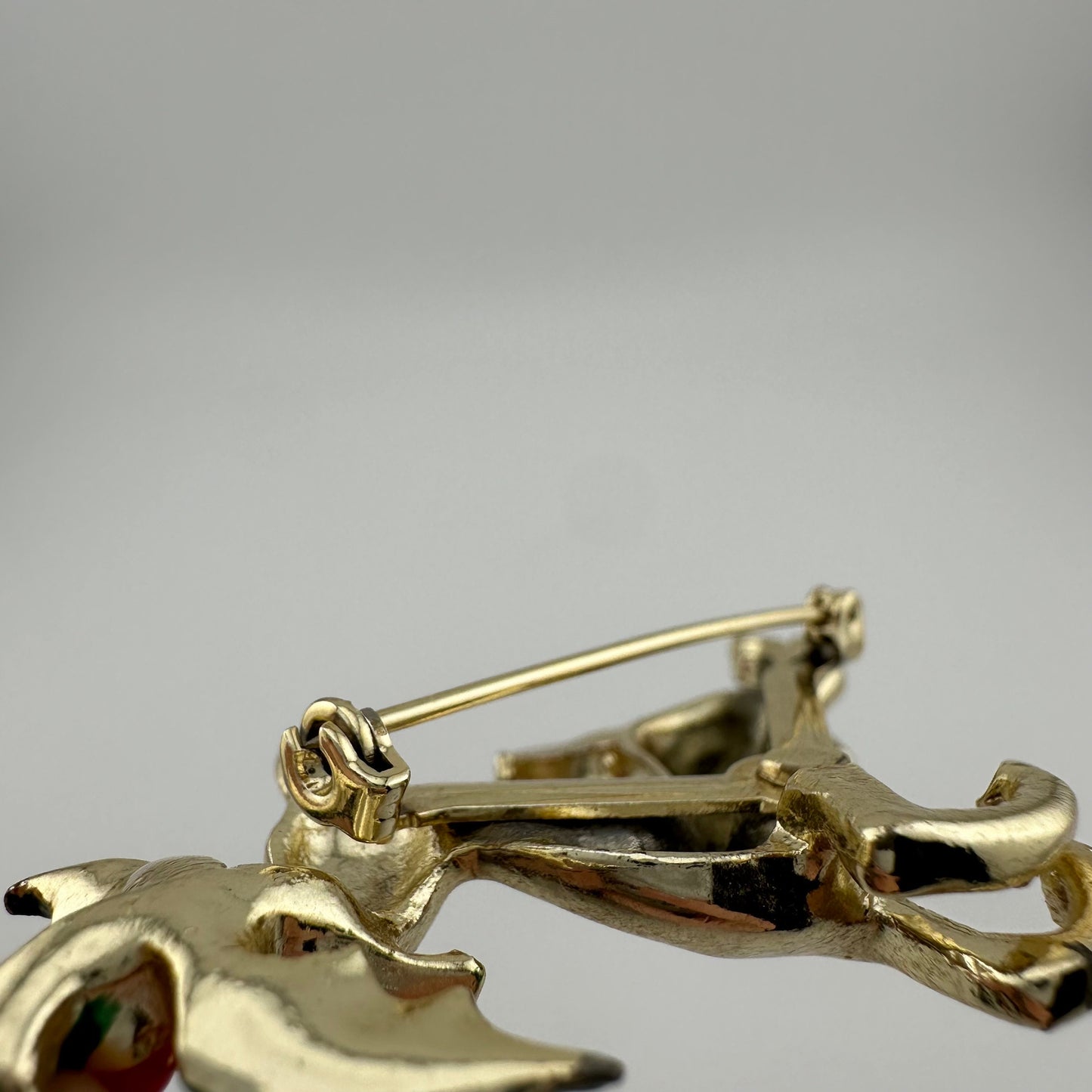 Vintage Leaping Reindeer Christmas Brooch, Gold Tone with Holly Leaves.