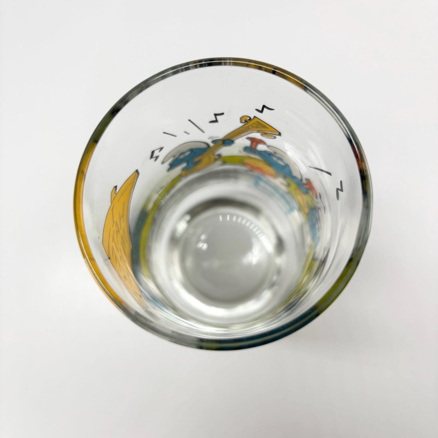 Vintage Glass of Grouchy Smurf Holding 'I Hate Music' Sign 1983