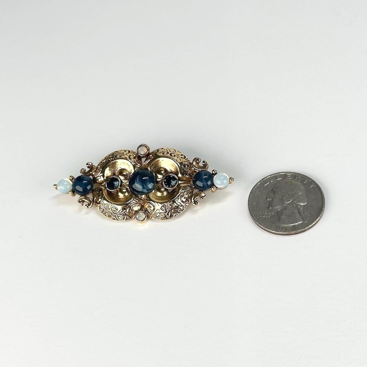 Vintage Brooch in Gold Tone Design with Blue Opalescent Stones
