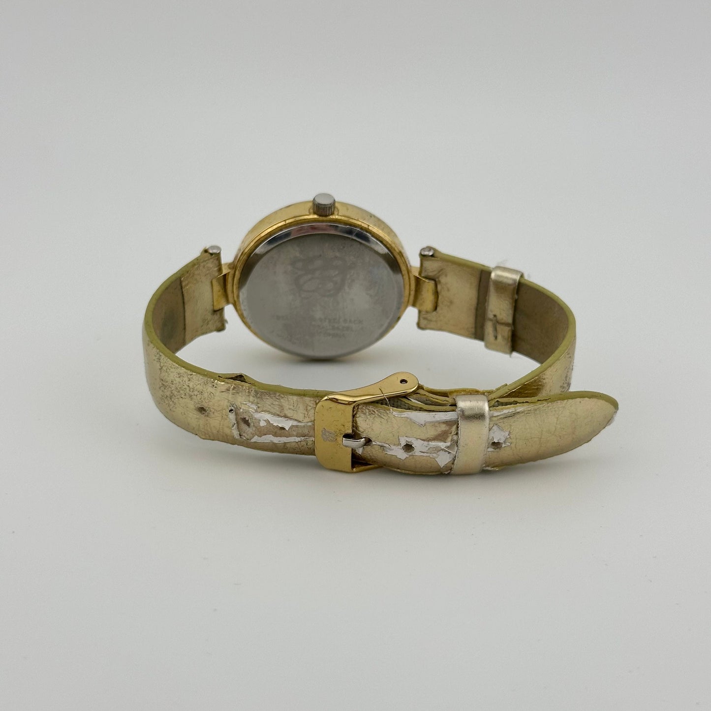 Vintage Elizabeth Taylor White Diamonds Gold Tone Watch with Faux Leather Strap.