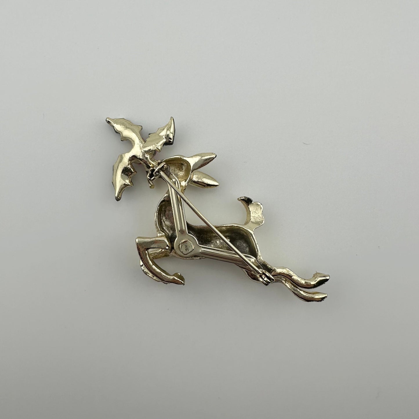Vintage Leaping Reindeer Christmas Brooch, Gold Tone with Holly Leaves.