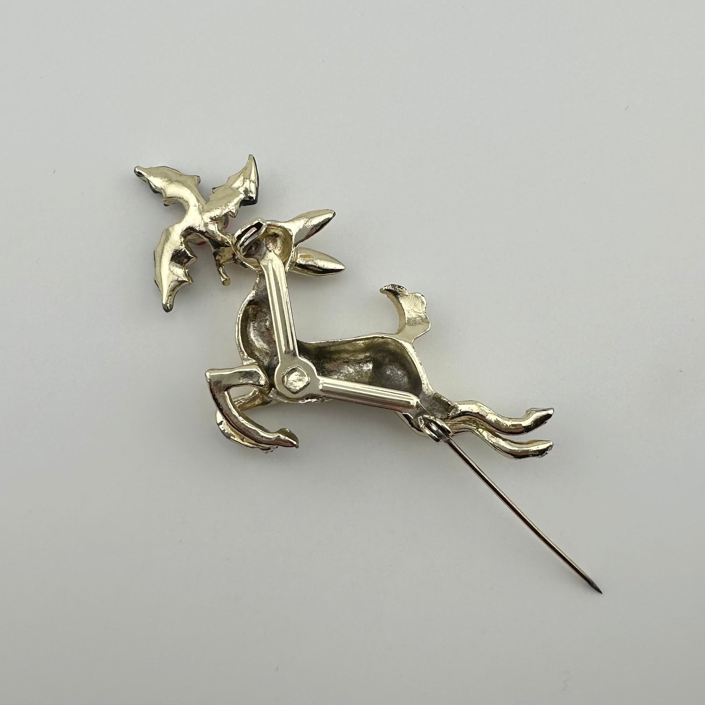 Vintage Leaping Reindeer Christmas Brooch, Gold Tone with Holly Leaves.