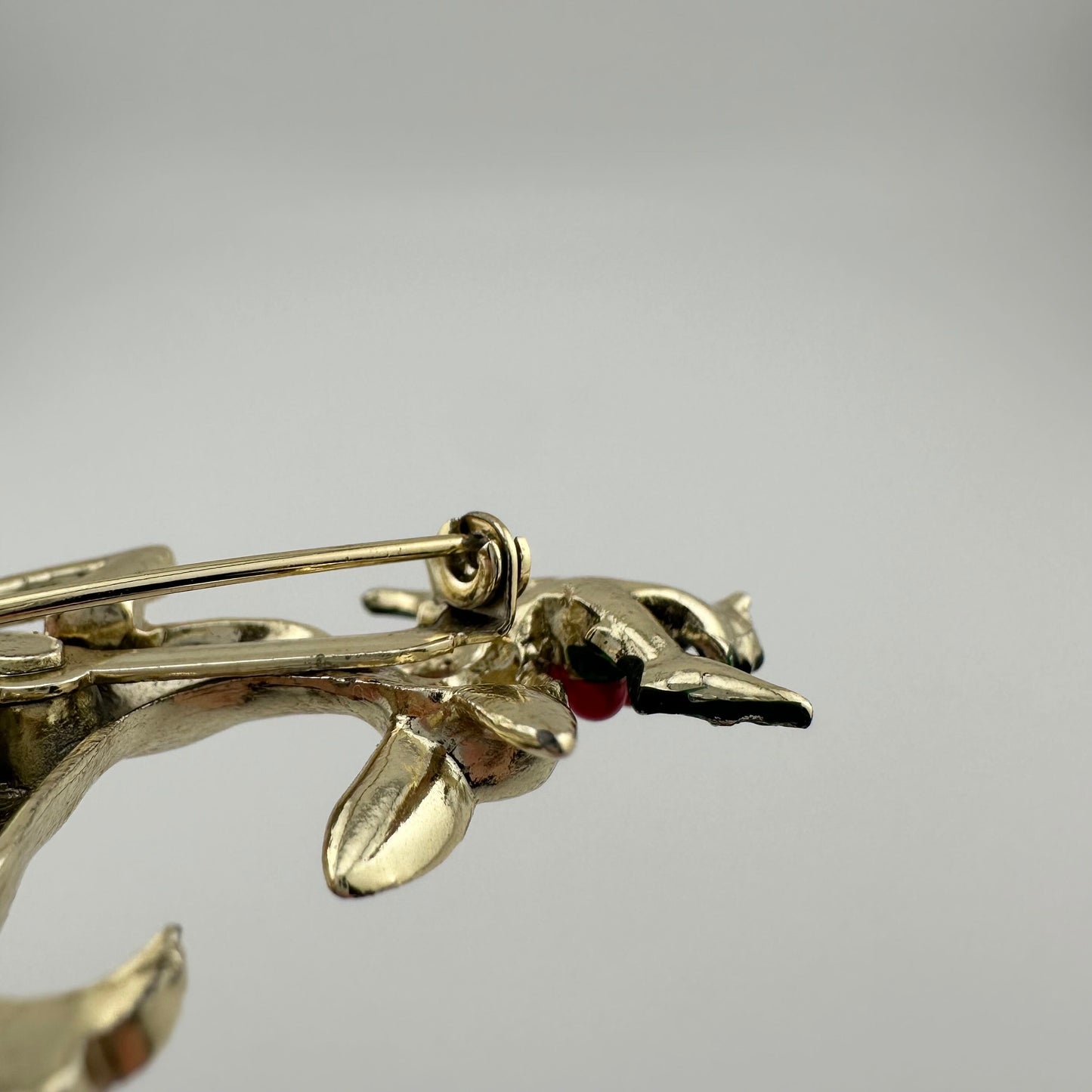 Vintage Leaping Reindeer Christmas Brooch, Gold Tone with Holly Leaves.