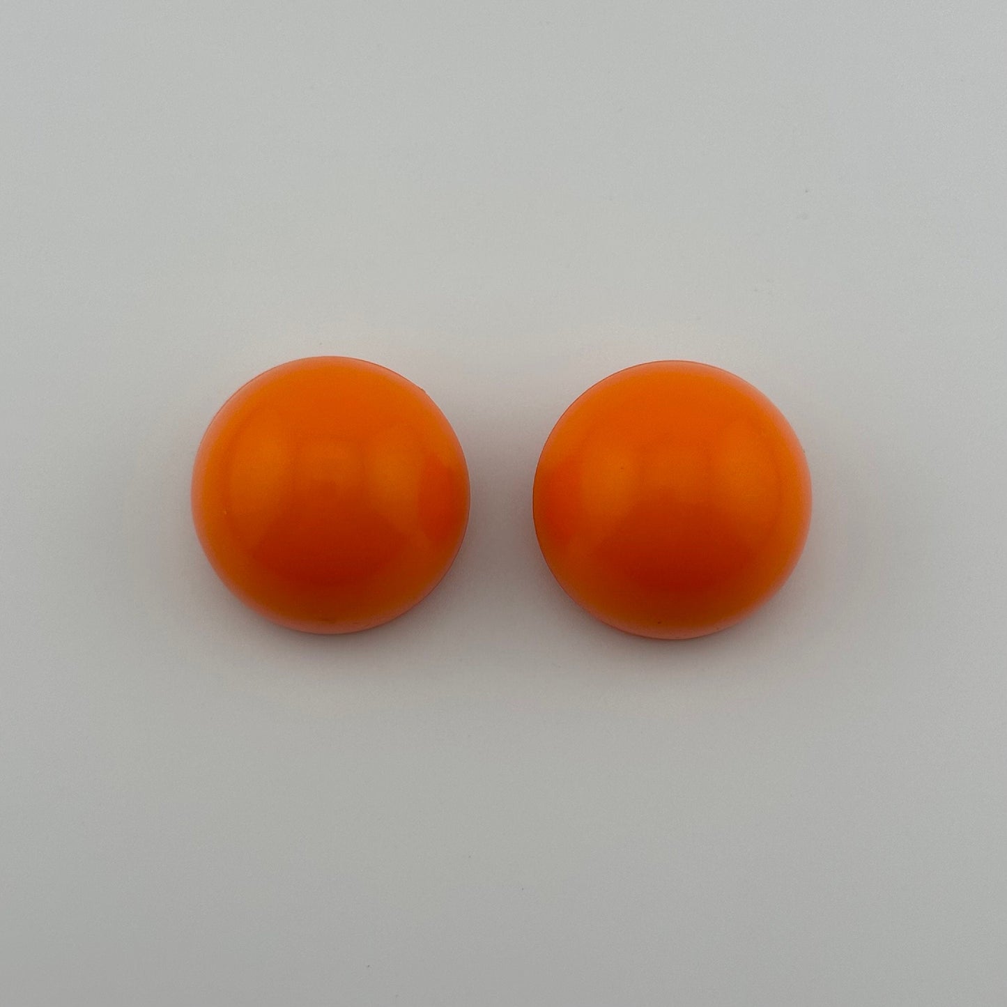 Vintage Clip-on Earrings, Neon Orange with Silver Back.