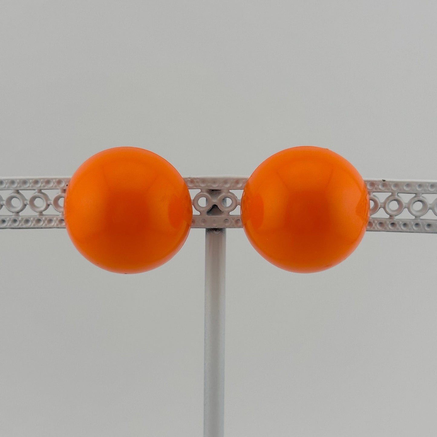 Vintage Clip-on Earrings, Neon Orange with Silver Back.