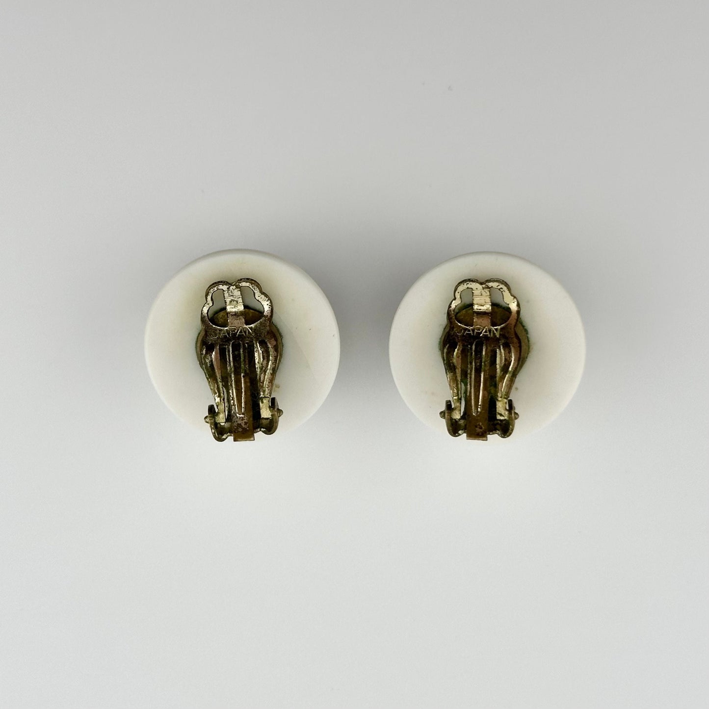 Vintage Plastic Clip-On Earrings, White with Gold-Tone Back, Made in Japan.