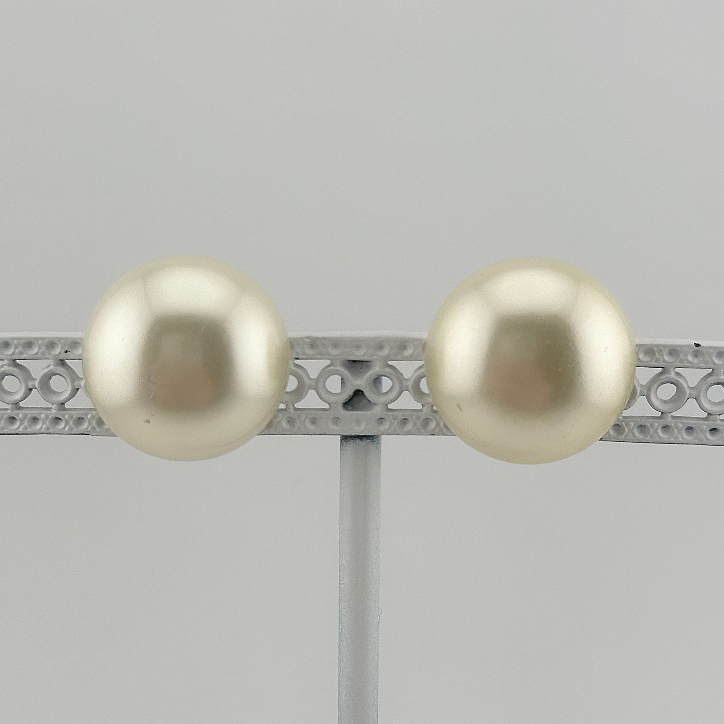 Vintage Clip-On Earrings, Iridescent White Plastic with Silver Back.