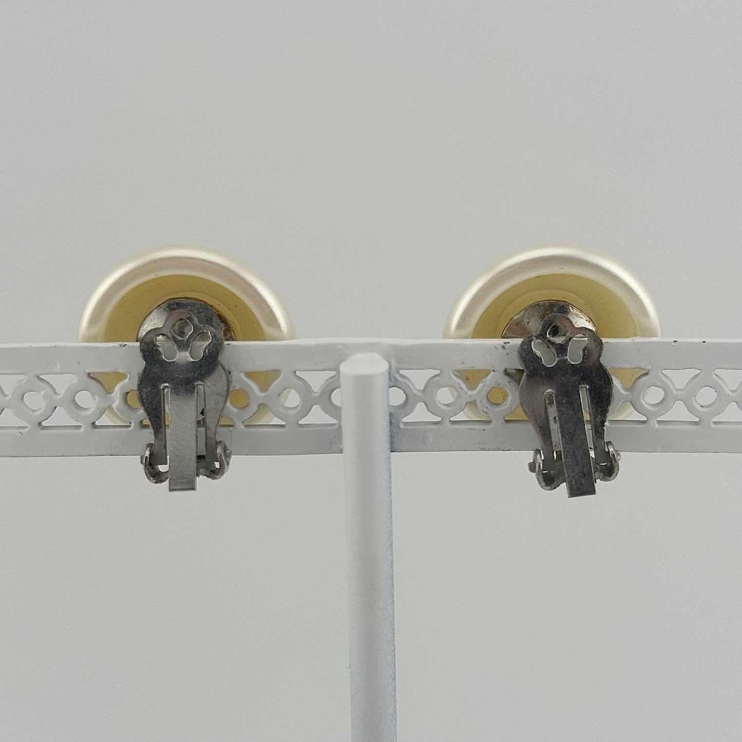 Vintage Clip-On Earrings, Iridescent White Plastic with Silver Back.