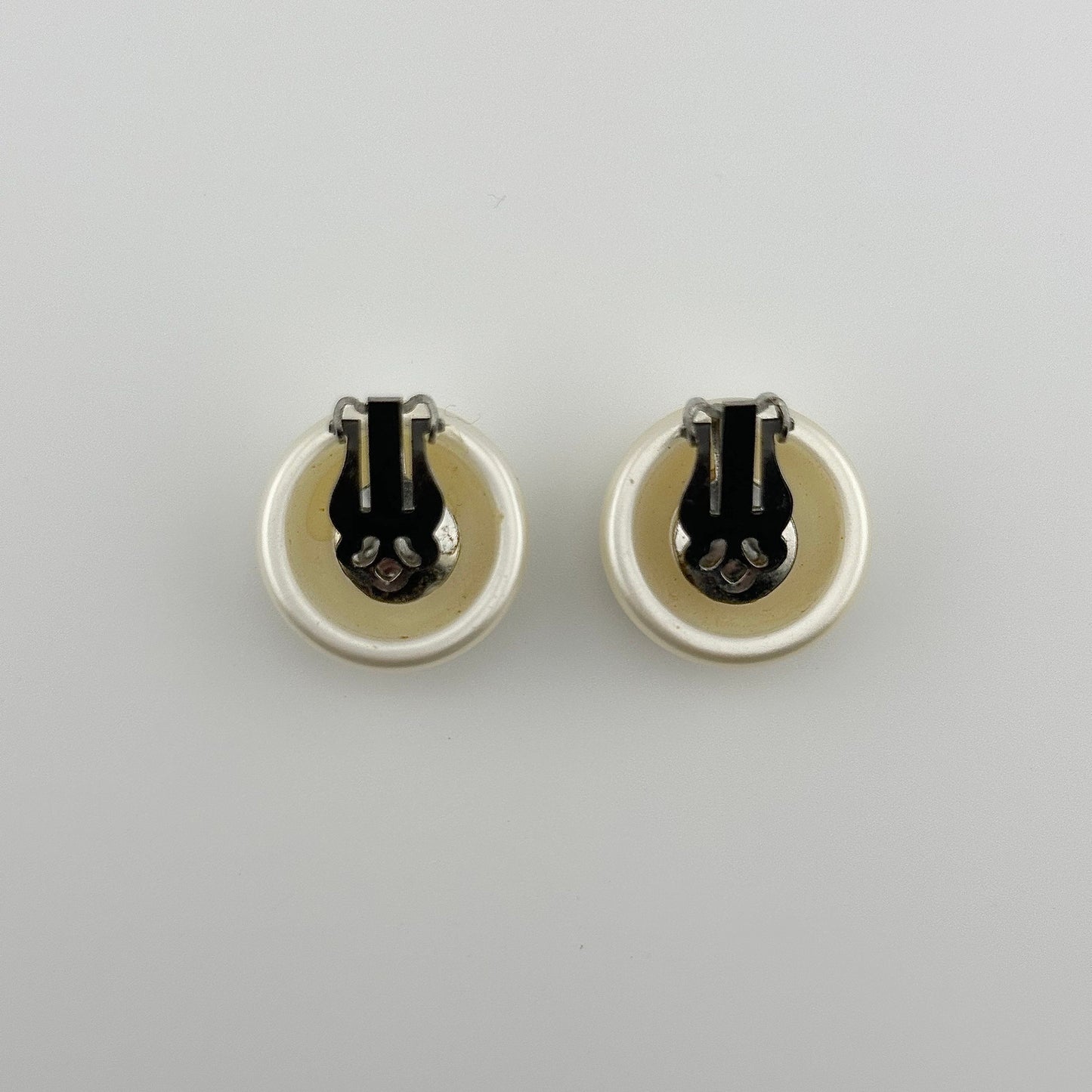 Vintage Clip-On Earrings, Iridescent White Plastic with Silver Back.