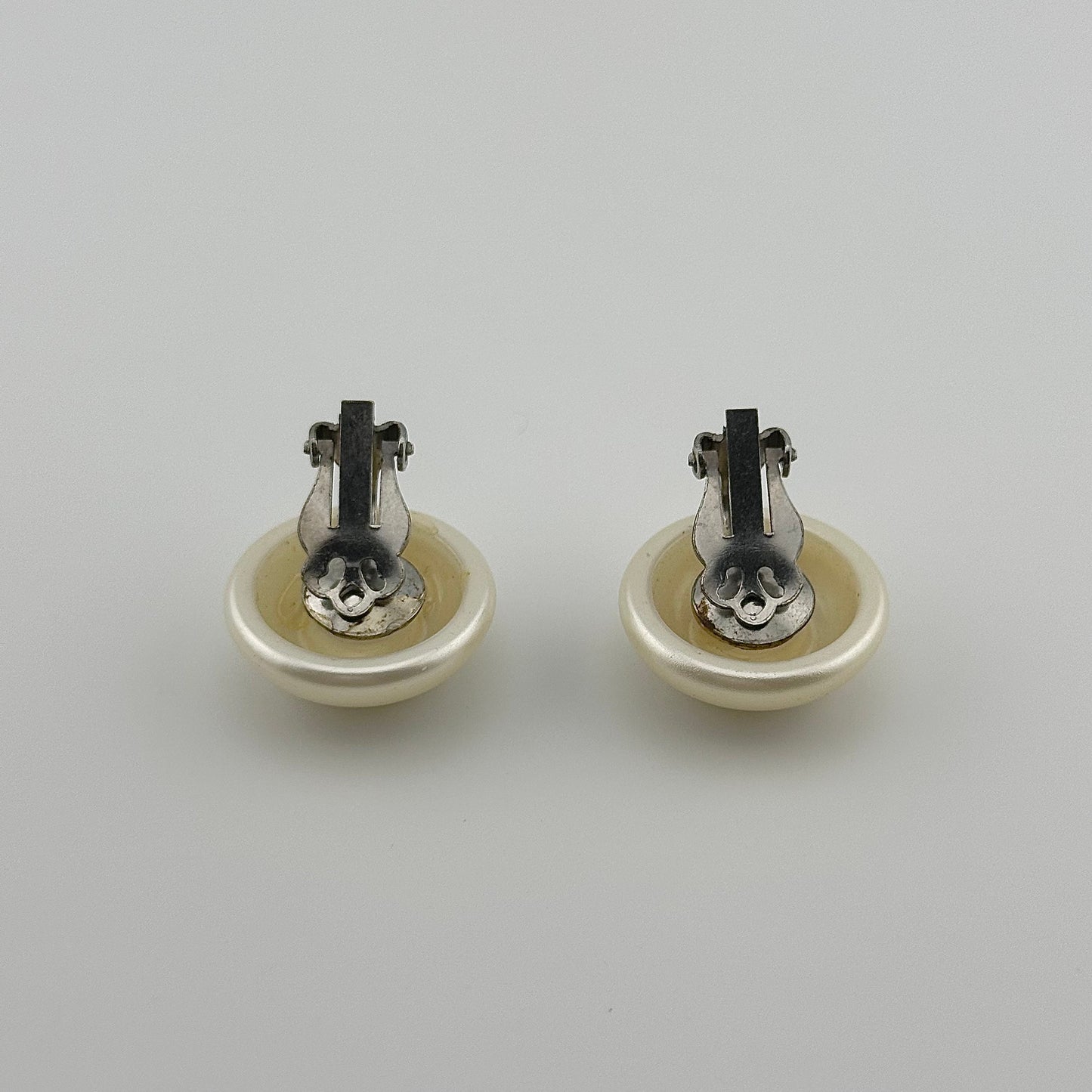 Vintage Clip-On Earrings, Iridescent White Plastic with Silver Back.