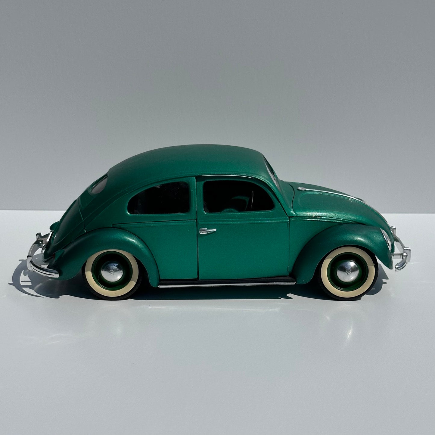 Vintage Die-Cast Model Car of a Green Volkswagen Beetle Echella Solido and Made in France.