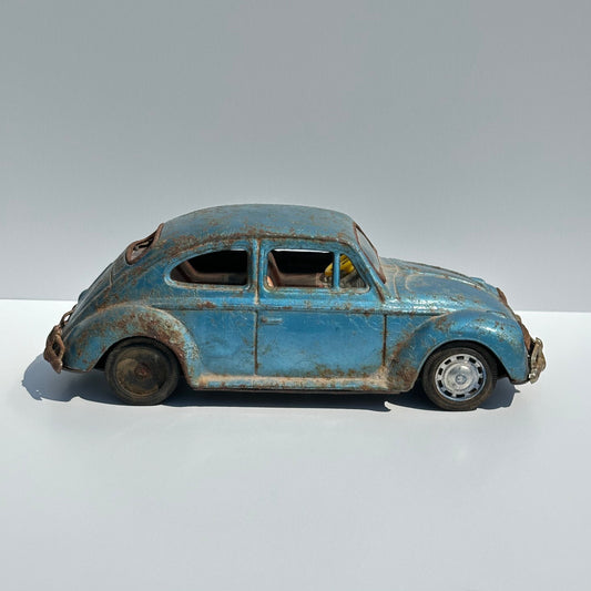 Vintage Car of a Blue Volkswagen Beetle and Made in Japan 1960s
