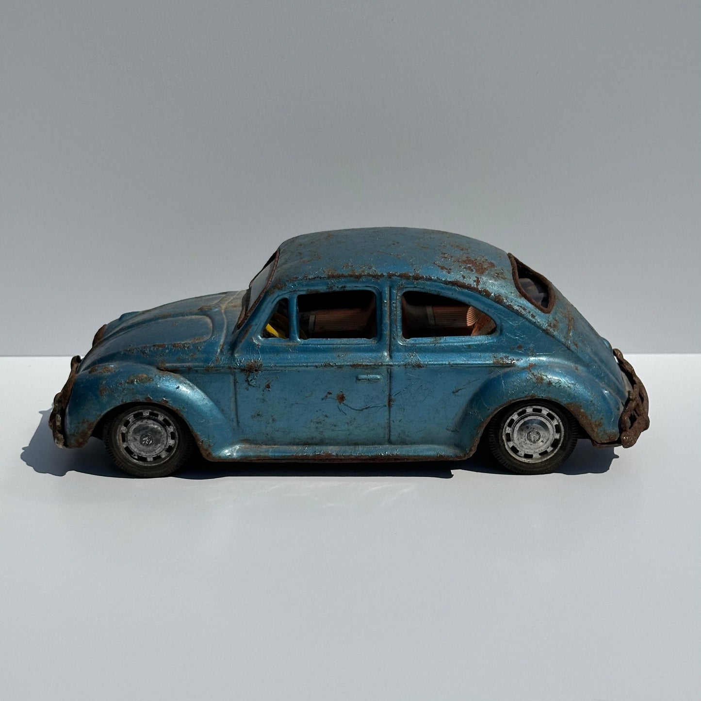 Vintage Car of a Blue Volkswagen Beetle and Made in Japan 1960s