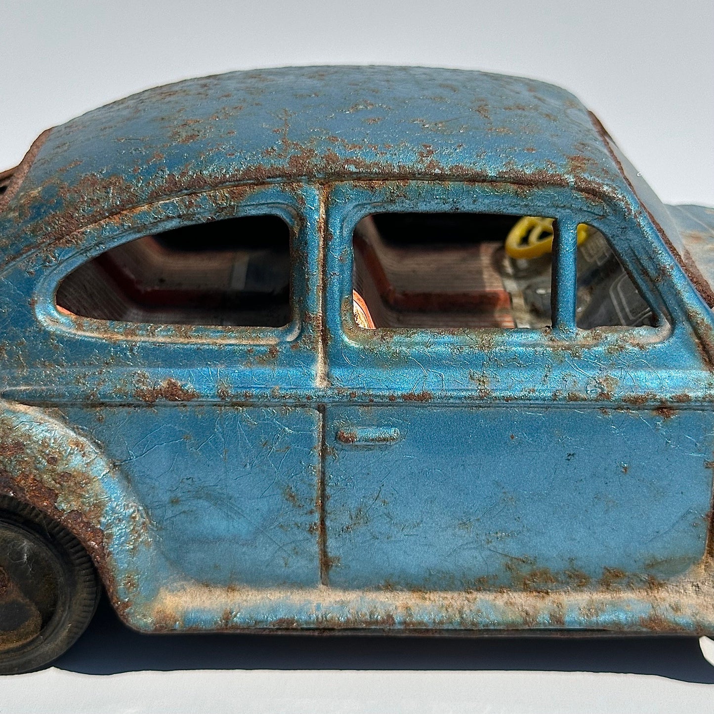 Vintage Car of a Blue Volkswagen Beetle and Made in Japan 1960s