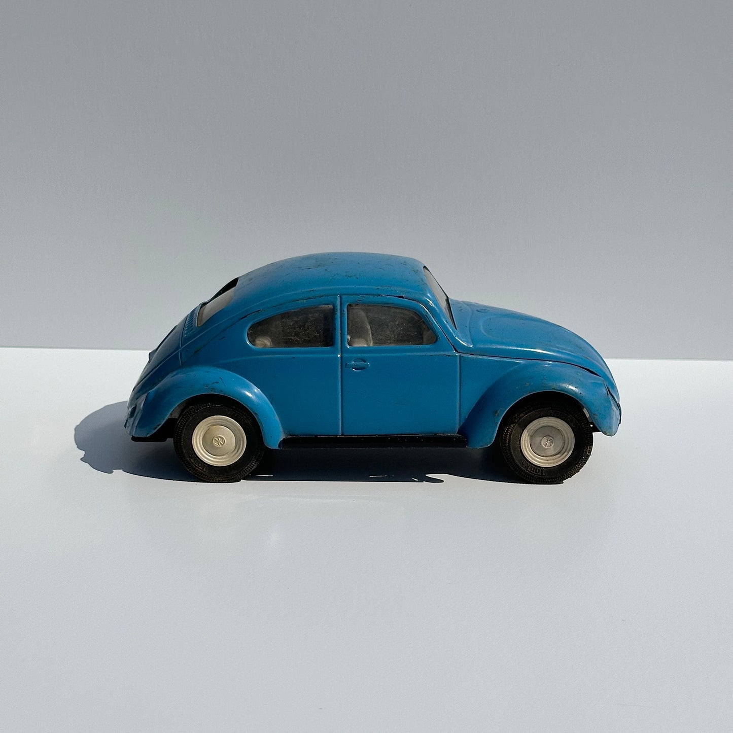 Vintage Metal Car of a Volkswagen Beetle by Tonya