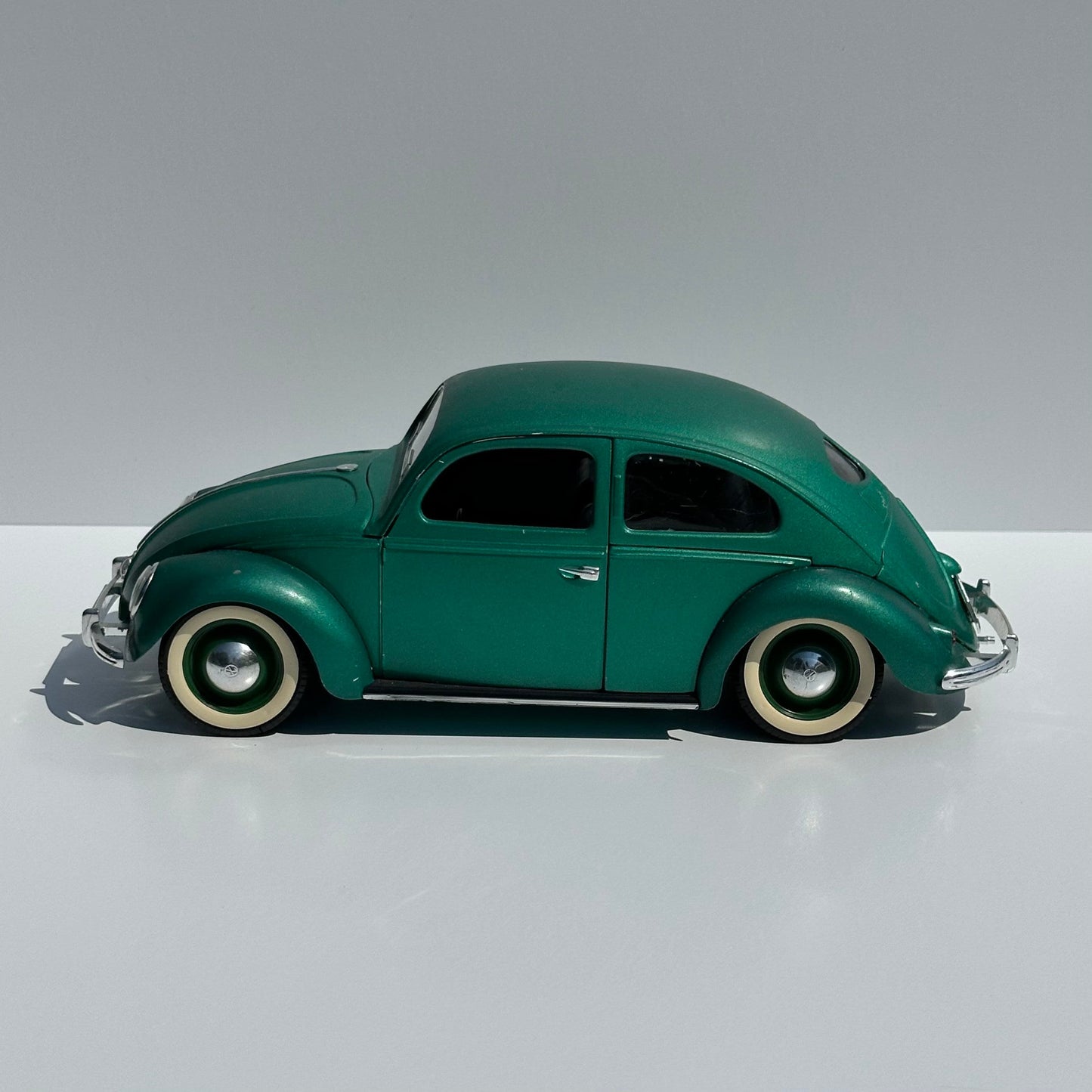 Vintage Die-Cast Model Car of a Green Volkswagen Beetle Echella Solido and Made in France.