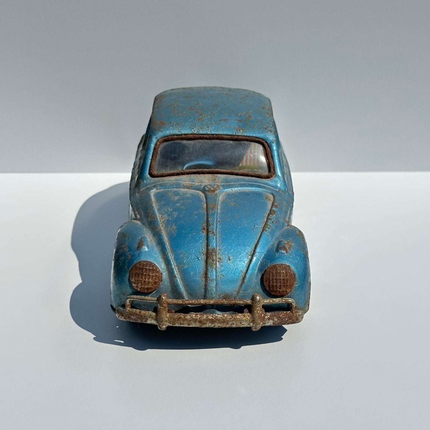 Vintage Car of a Blue Volkswagen Beetle and Made in Japan 1960s