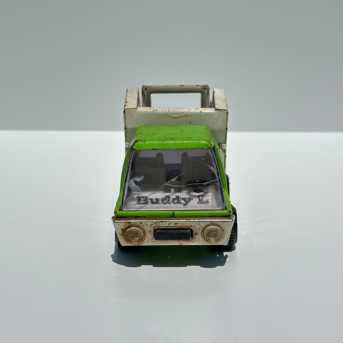 Vintage Green Dump Truck in Pressed Steel by Buddy L. and Made in Japan.