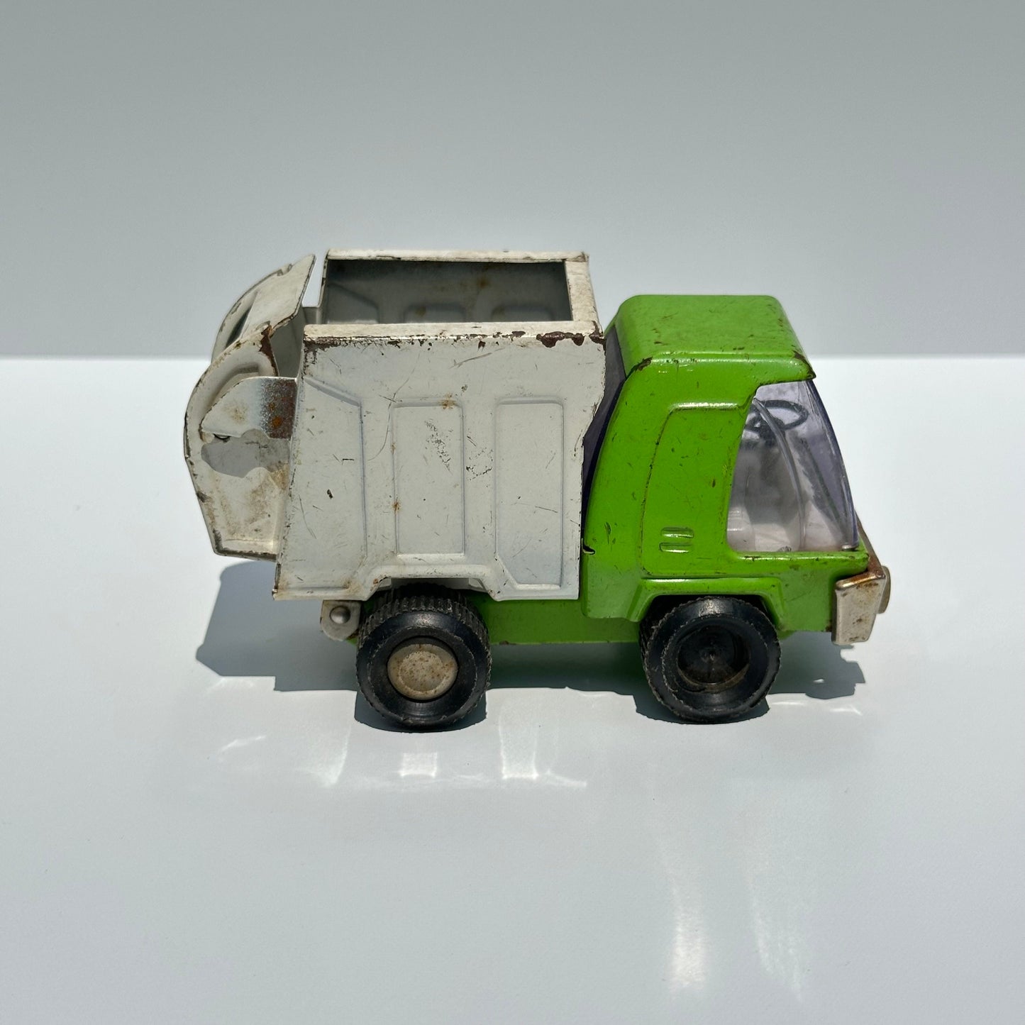 Vintage Green Dump Truck in Pressed Steel by Buddy L. and Made in Japan.
