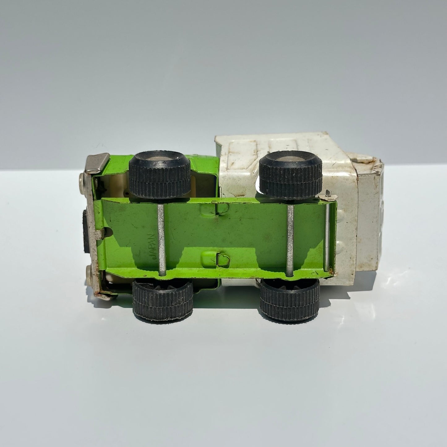 Vintage Green Dump Truck in Pressed Steel by Buddy L. and Made in Japan.