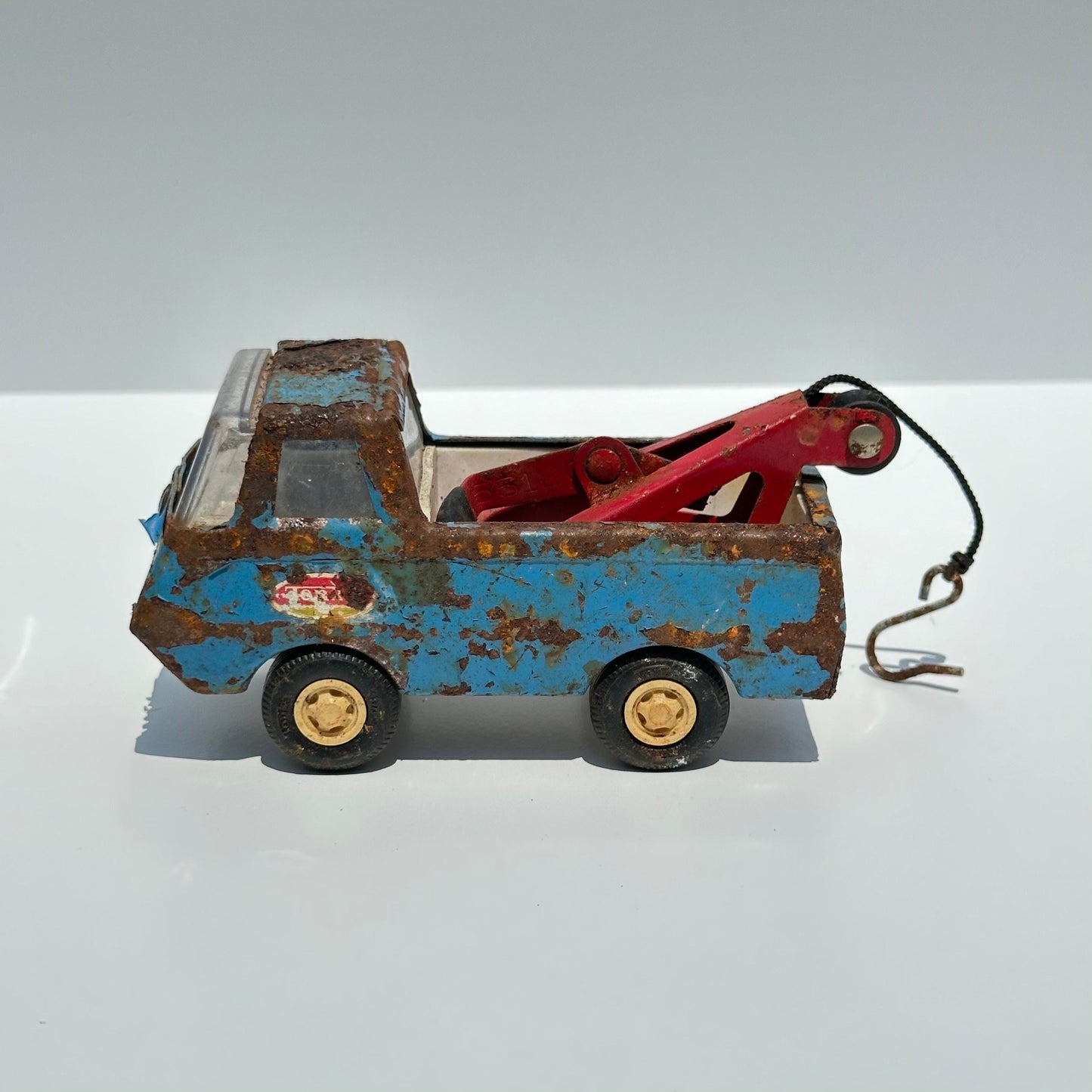 Vintage Blue Tow Truck Die-Cast Car Model Made by Tonka in 1960s.