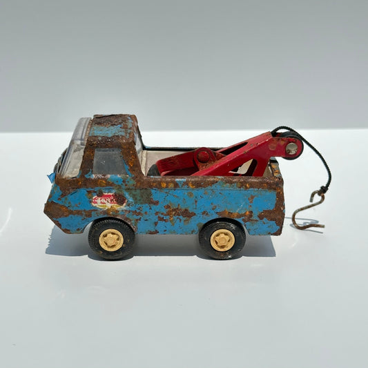 Vintage Blue Tow Truck Die-Cast Car Model Made by Tonka in 1960s.