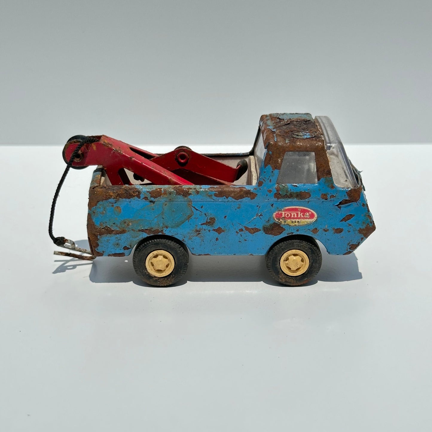 Vintage Blue Tow Truck Die-Cast Car Model Made by Tonka in 1960s.
