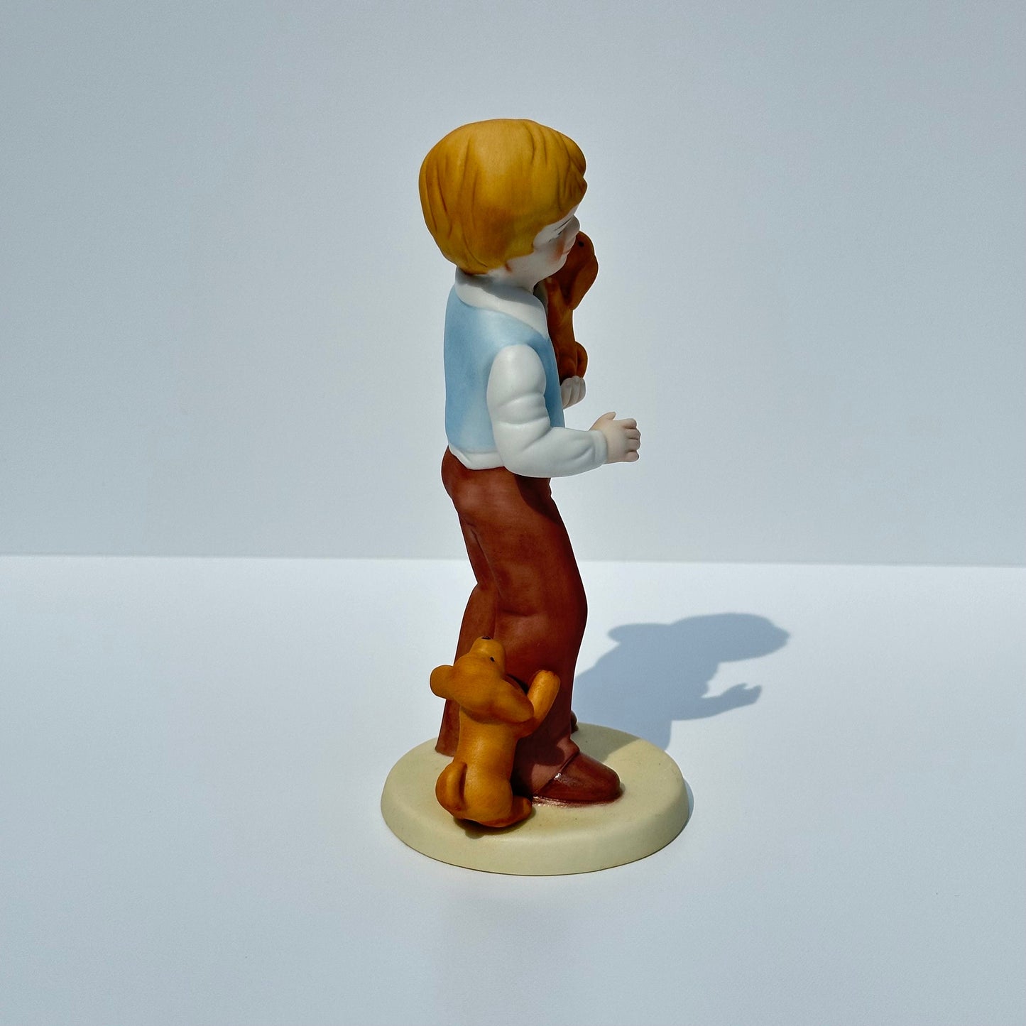Vintage Porcelain Figurine of Boy with Puppies by Avon 1981 Collectible