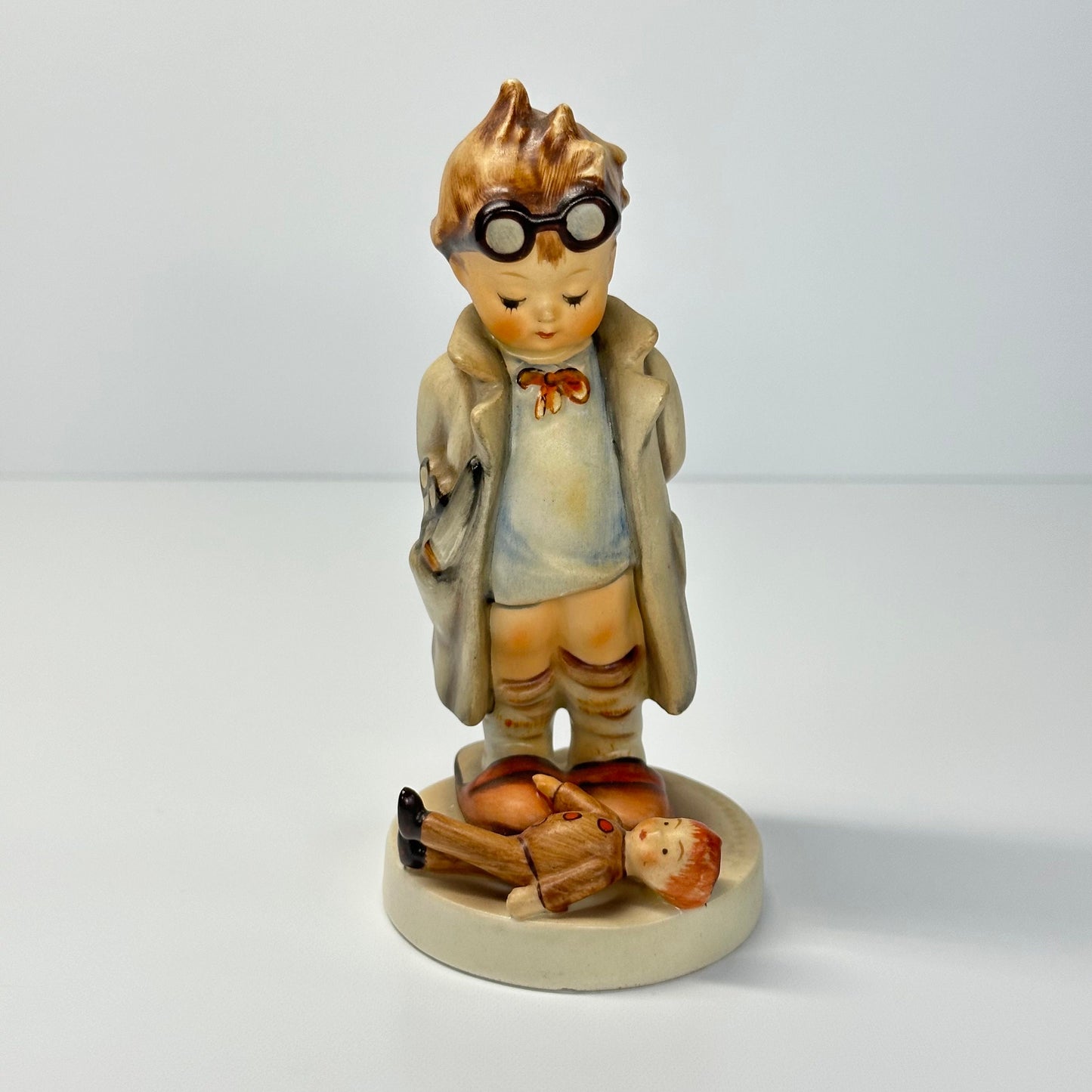 Vintage Hummel Figurine of Doctor with Doll #127 and Made in West Germany.