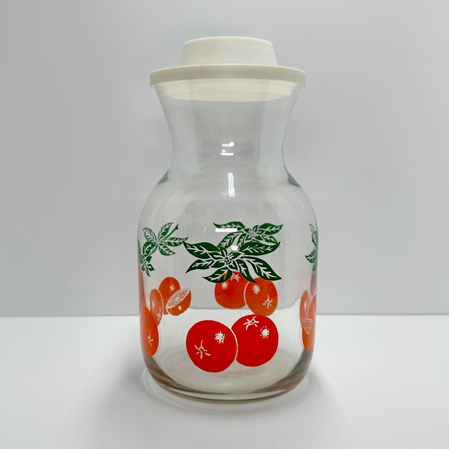 Vintage Carafe with Orange Design and White Lid Made by Anchor Hocking.