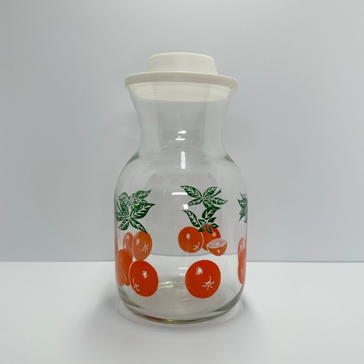 Vintage Carafe with Orange Design and White Lid Made by Anchor Hocking.