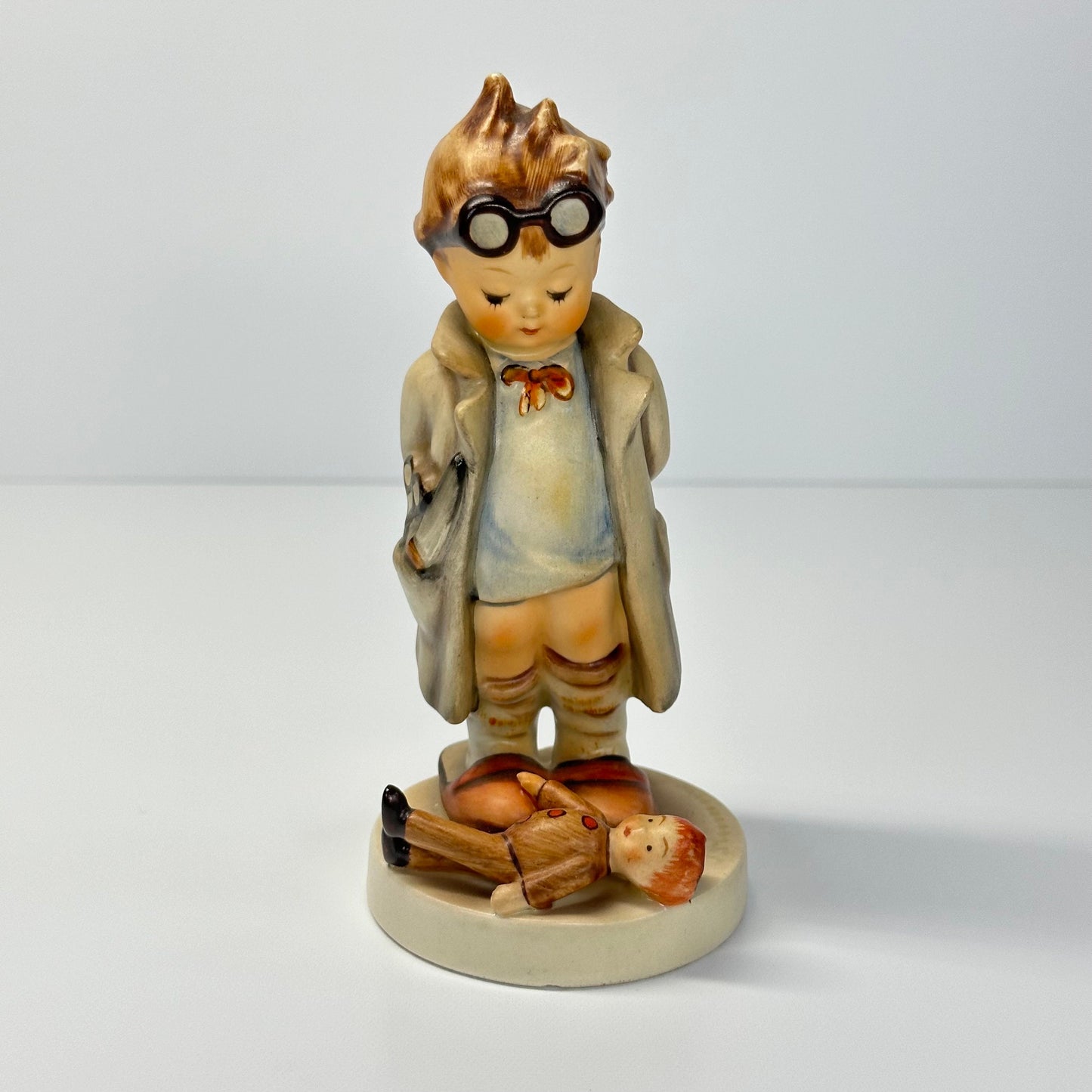 Vintage Hummel Figurine of Doctor with Doll #127 and Made in West Germany.