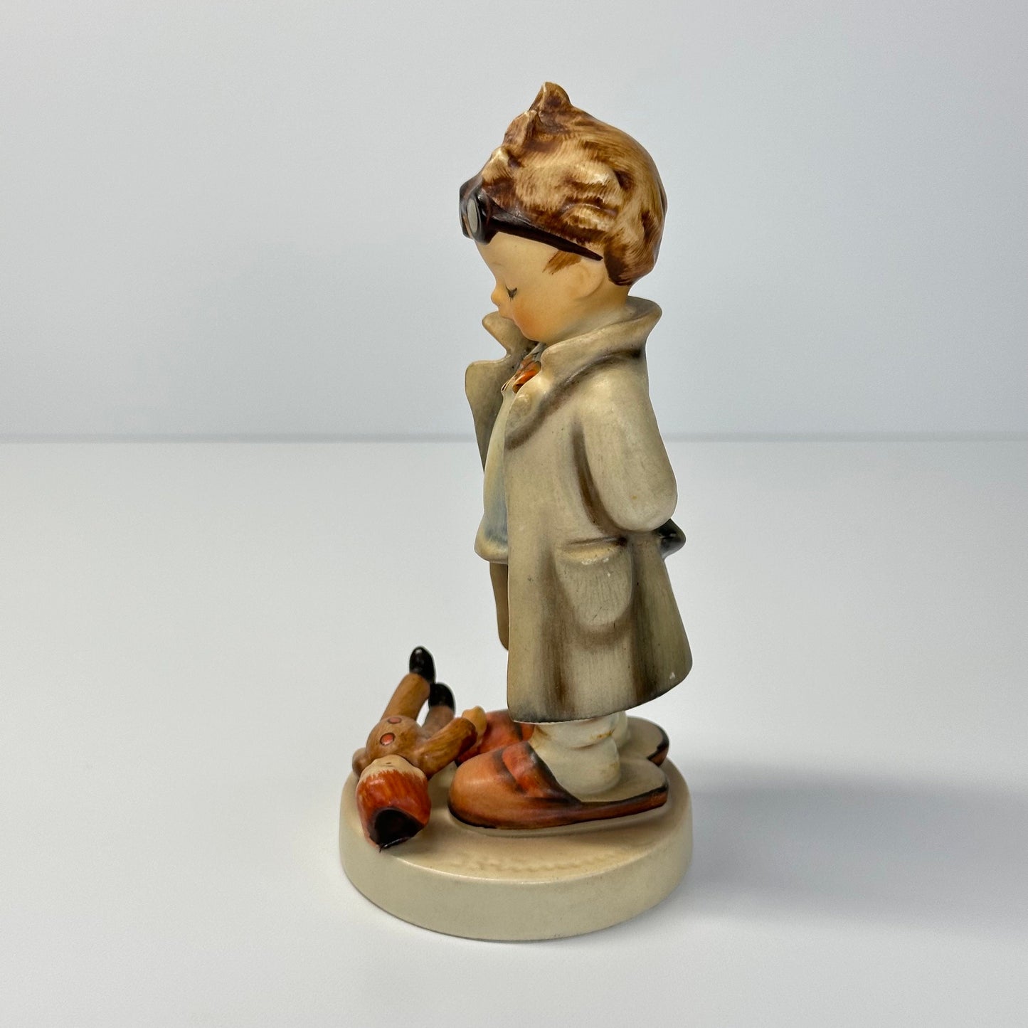 Vintage Hummel Figurine of Doctor with Doll #127 and Made in West Germany.