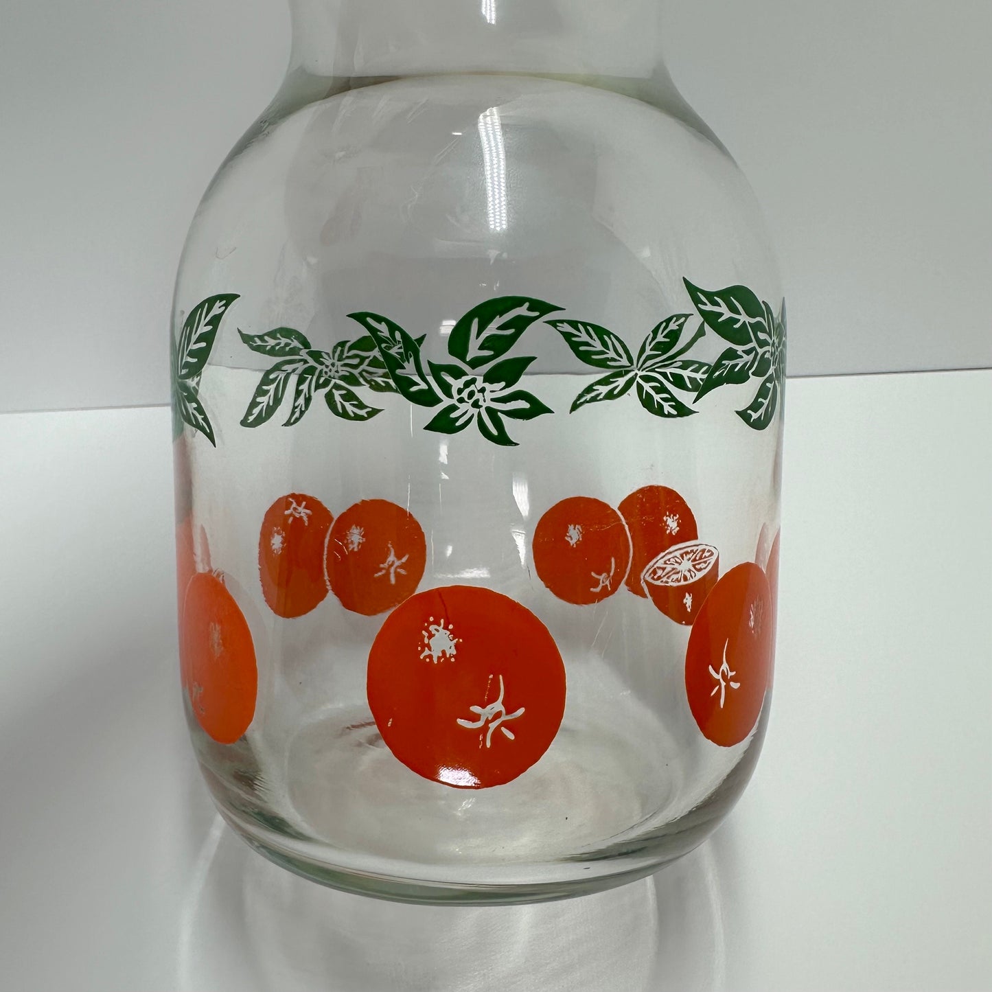 Vintage Carafe with Orange Design and White Lid Made by Anchor Hocking.