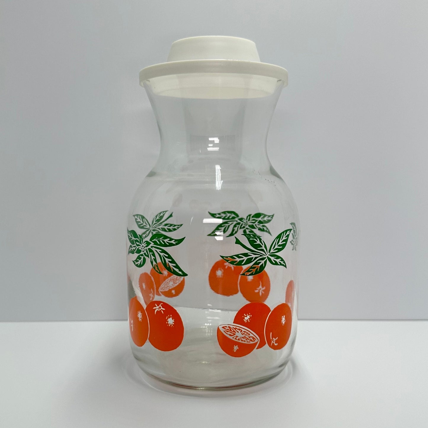 Vintage Carafe with Orange Design and White Lid Made by Anchor Hocking.
