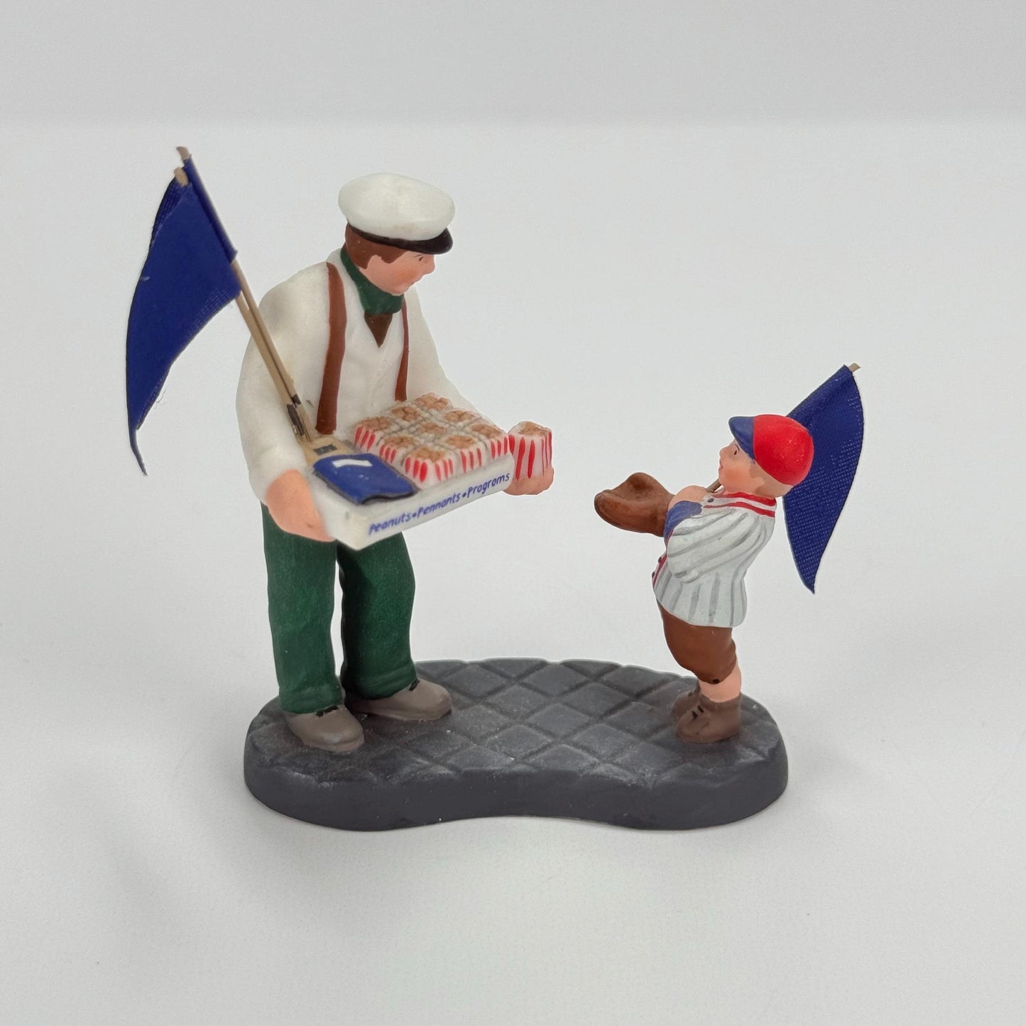 Vintage Department 56 Christmas Village Figurine of Peanuts, Pennants, & Programs