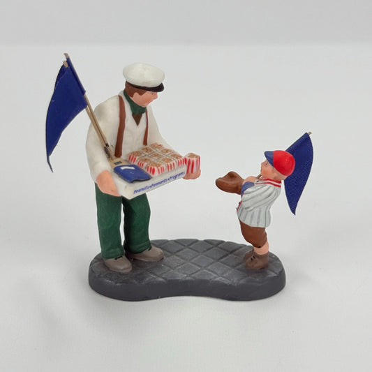 Vintage Department 56 Christmas Village Figurine of Peanuts, Pennants, & Programs