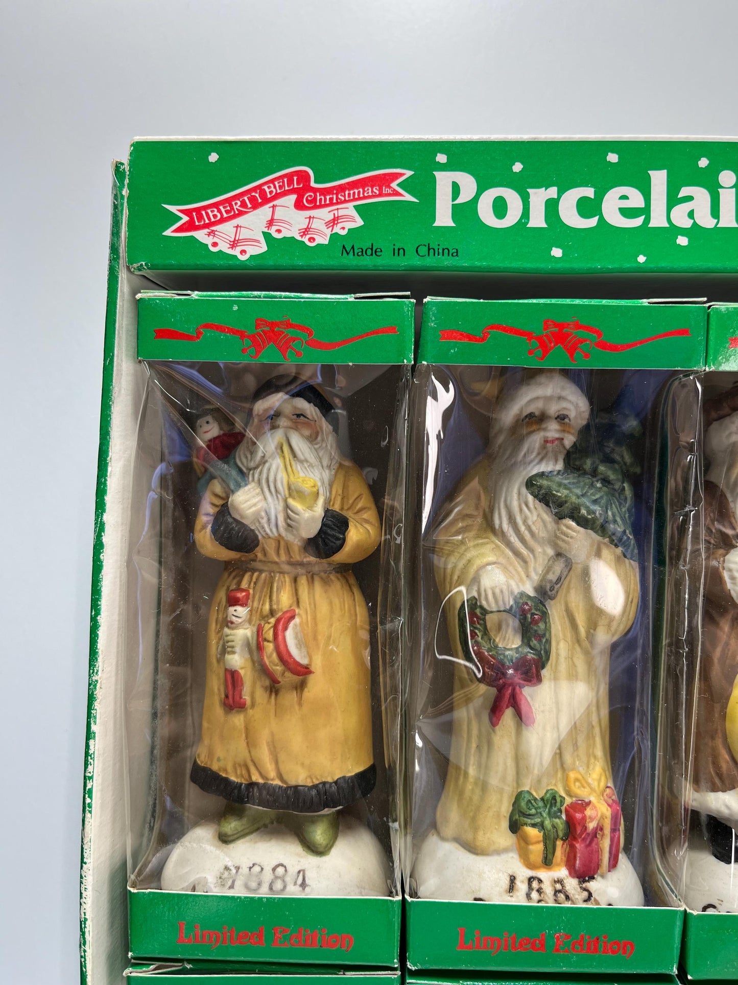 Vintage Porcelain Figurines of Santa by Liberty Bell in Limited Edition 12pc Set