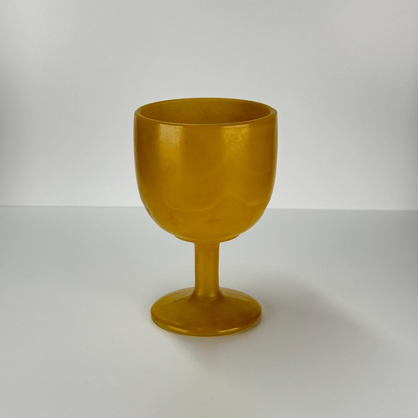 Vintage Carnival Wine Glass in Golden Yellow With Embossed Star Design 1960s