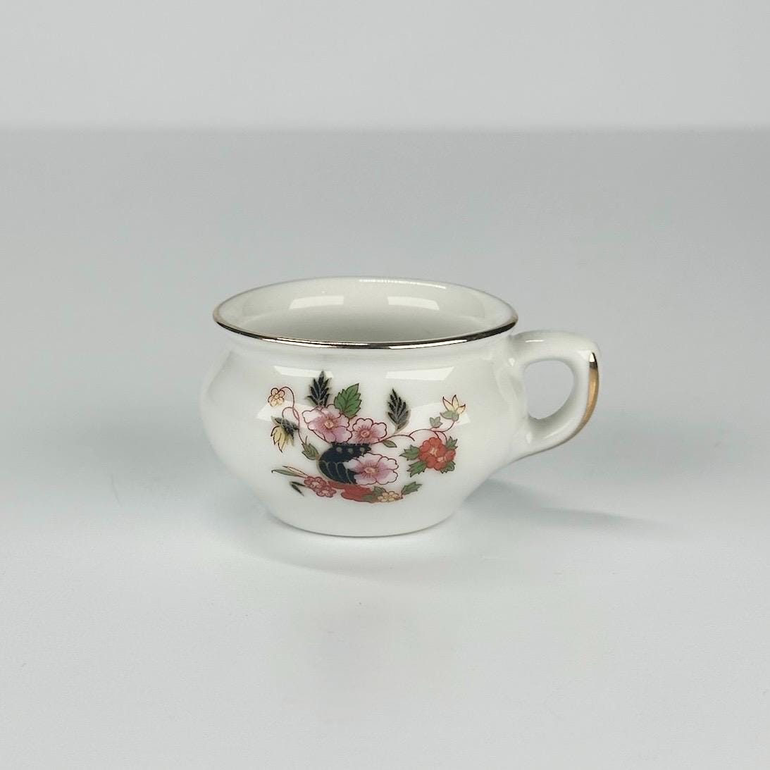 Vintage Miniature Tea Cup with Floral Design and Gold Rim