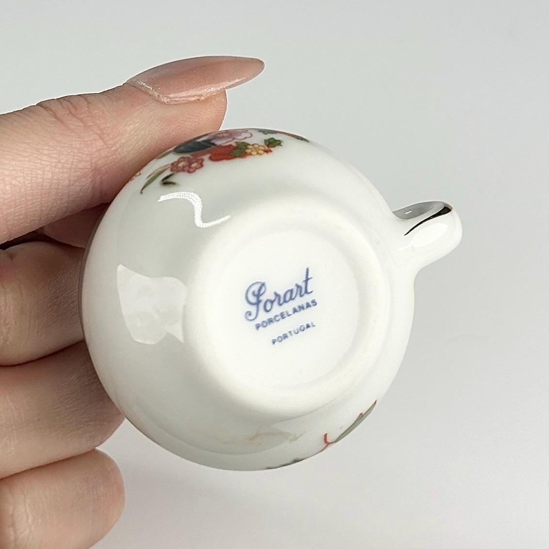 Vintage Miniature Tea Cup with Floral Design and Gold Rim
