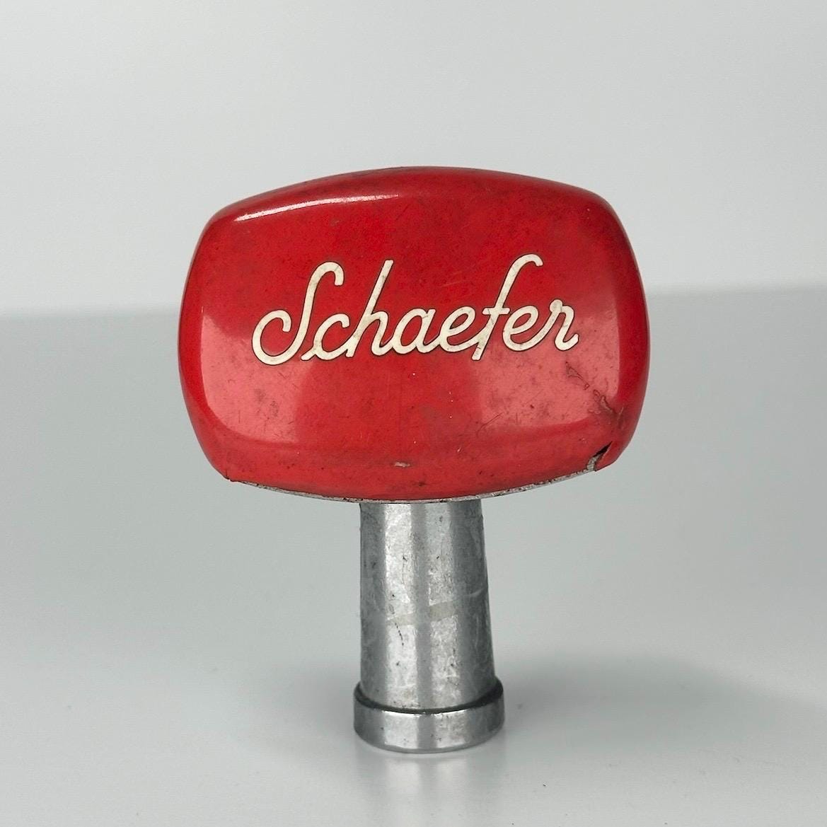 Vintage Beer Pull with Schaefer Lettering and Red Top by The F.&.M. Schaefer Brew Co.