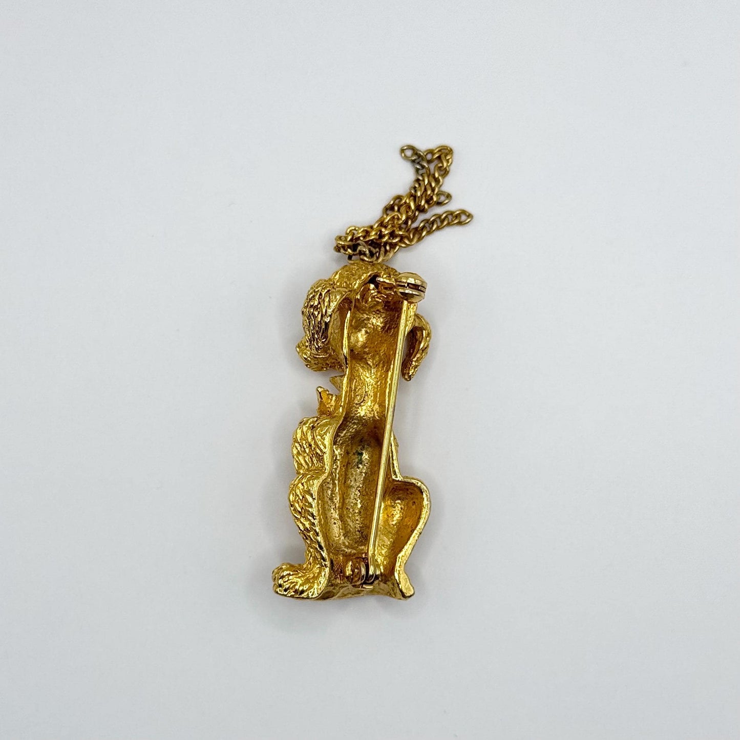 Vintage Brooch Pin of Poodle in Gold Tone with Green Rhinestone Eyes