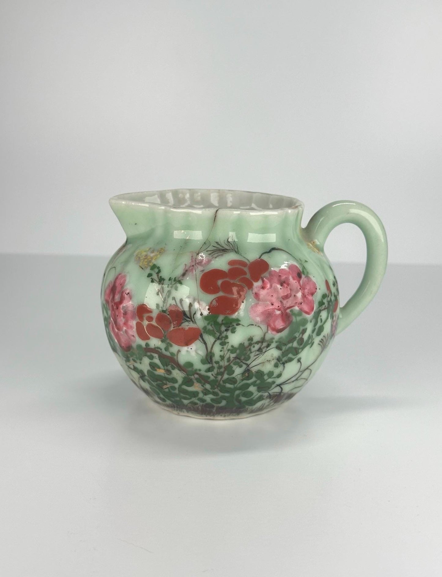 Antique Pitcher Made of Celadon Glazed Porcelain with Hand Painted Floral Design
