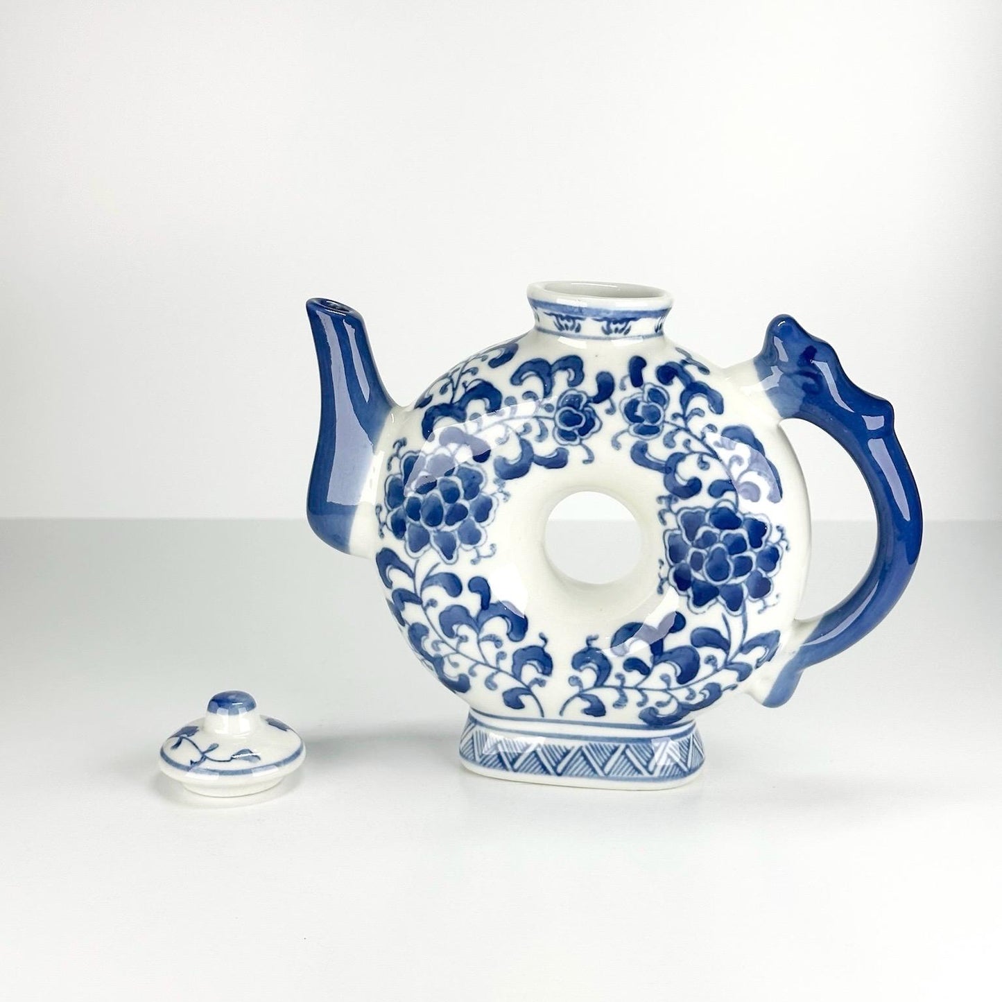 Vintage Teapot with Blue and White Floral Design in a Narrow Donut Shape