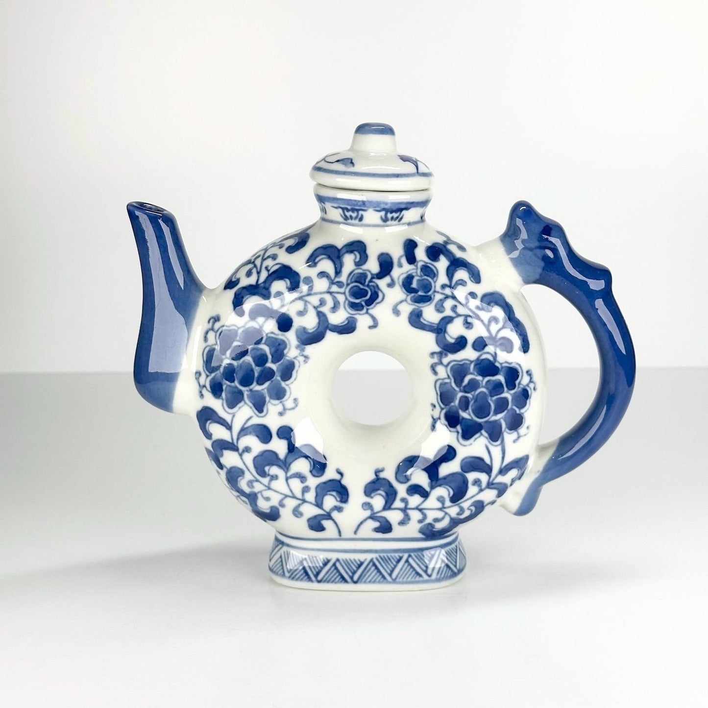 Vintage Teapot with Blue and White Floral Design in a Narrow Donut Shape