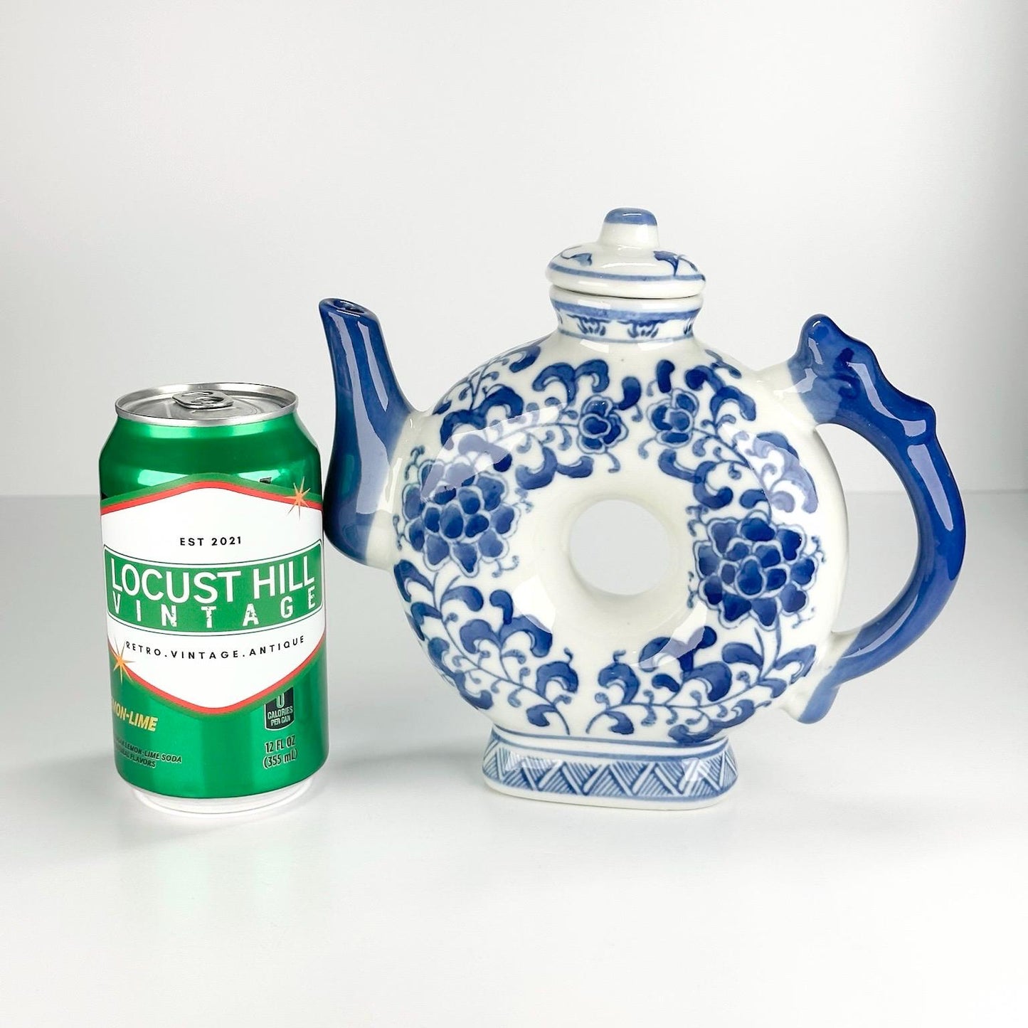 Vintage Teapot with Blue and White Floral Design in a Narrow Donut Shape