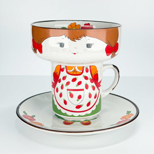 Vintage Stackable Bowl, Cup, and Plate of Little Girl with Pigtails and Strawberry Apron