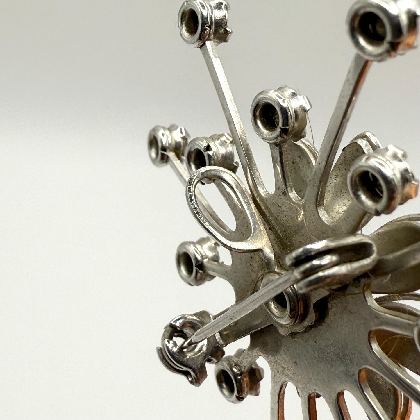 Vintage Brooch in Silver Flower Starburst Design with Blue Rhinestone Center
