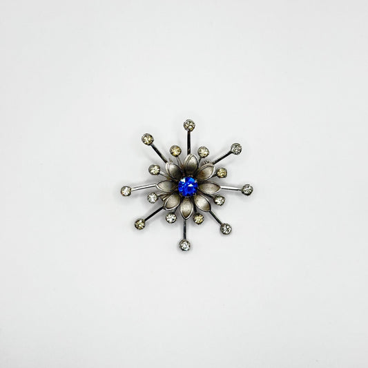 Vintage Brooch in Silver Flower Starburst Design with Blue Rhinestone Center